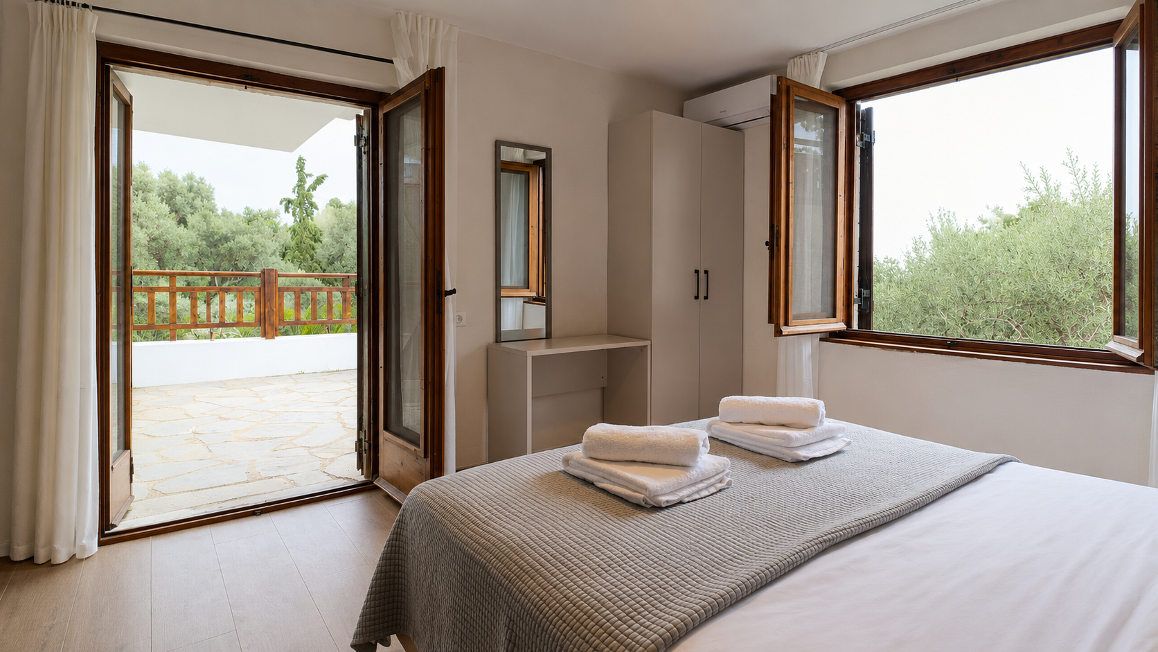 Airy bedroom with two garden-facing openings