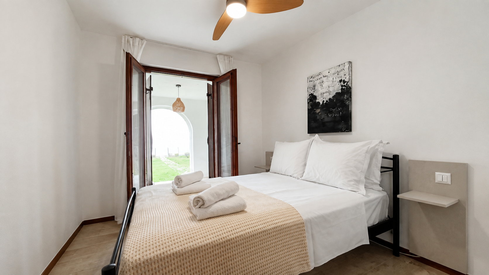 Lower-level bedroom facing the garden arches