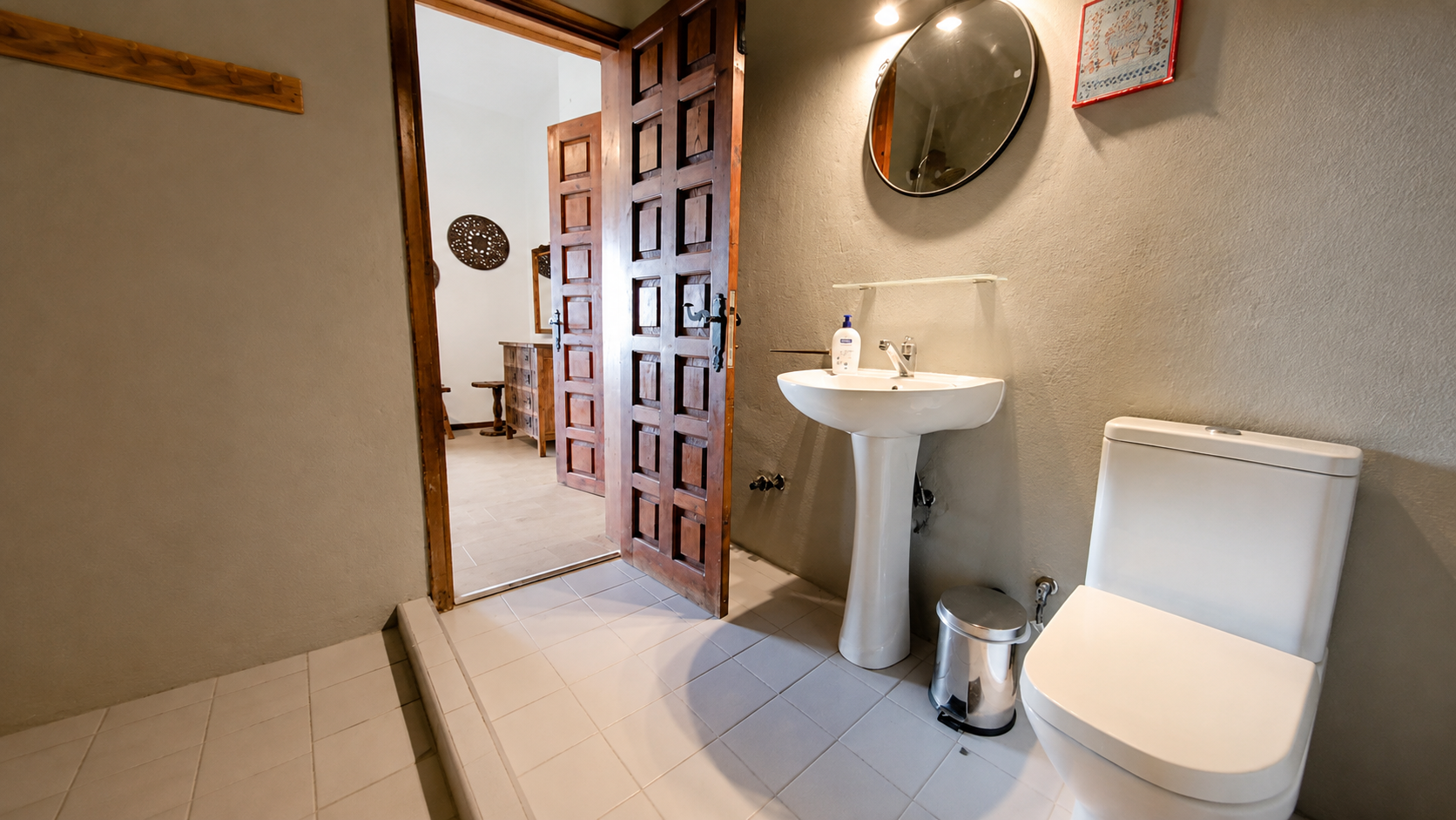 Guest bathroom with traditional wooden door