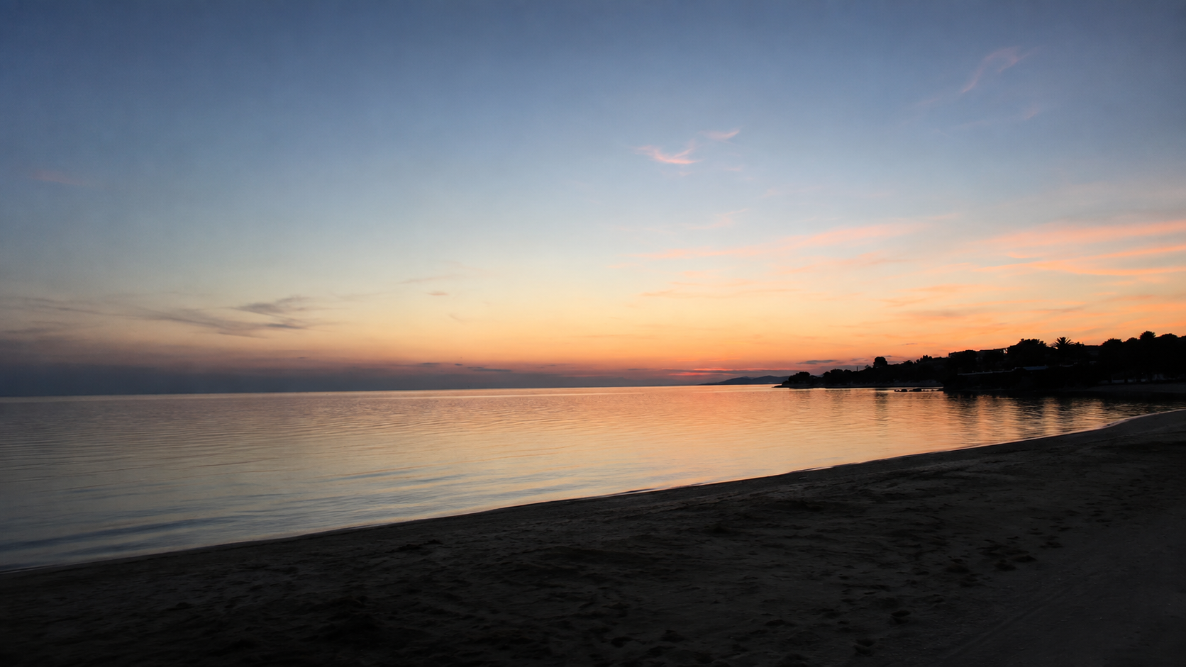 Calm shoreline at dusk